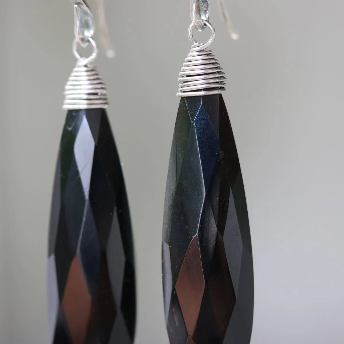 Black onyx teardrop faceted earrings with silver wire wrapped on oxidized sterling silver hooks style