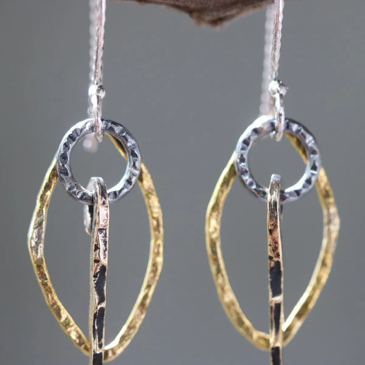 Brass Marquis shape earrings with silver circle and brass sticks on oxidized sterling silver hooks