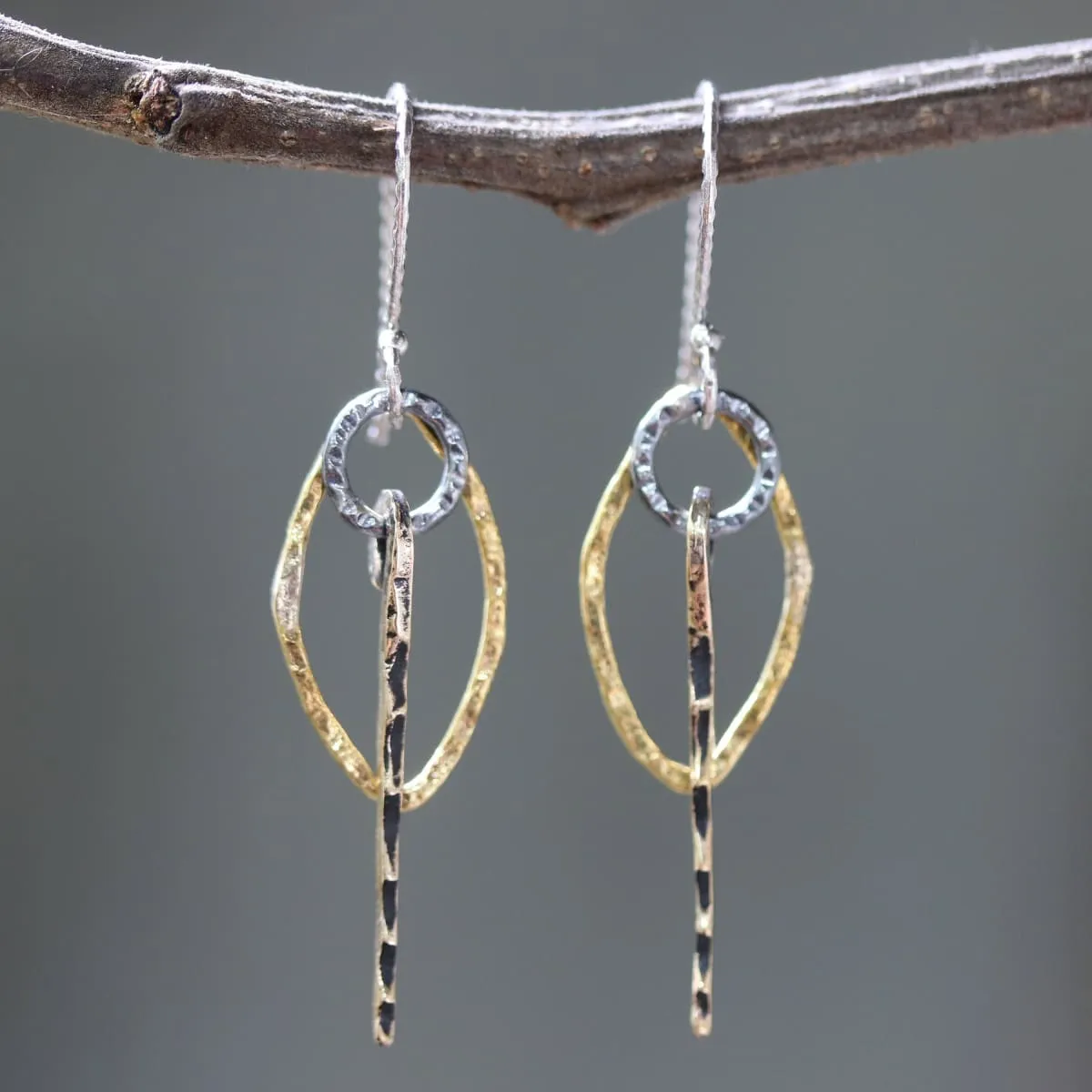 Brass Marquis shape earrings with silver circle and brass sticks on oxidized sterling silver hooks