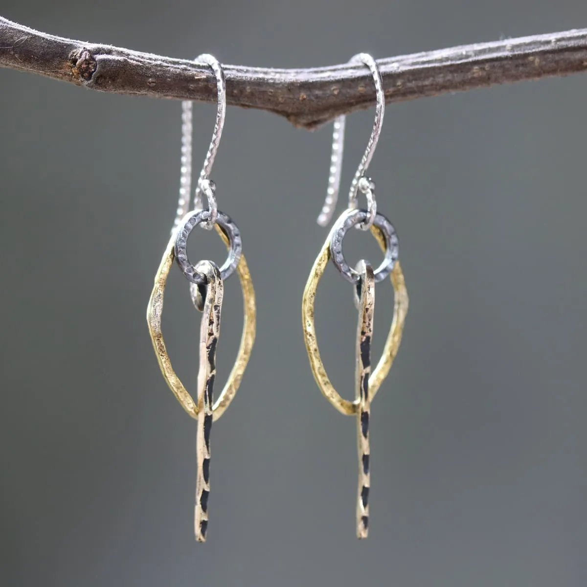 Brass Marquis shape earrings with silver circle and brass sticks on oxidized sterling silver hooks